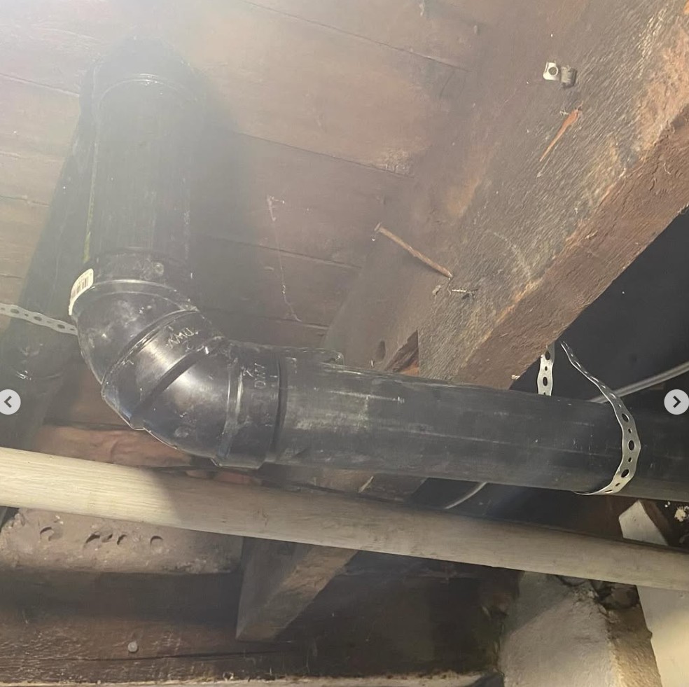 Blais Plumbing project: Drain fittings under floor joists